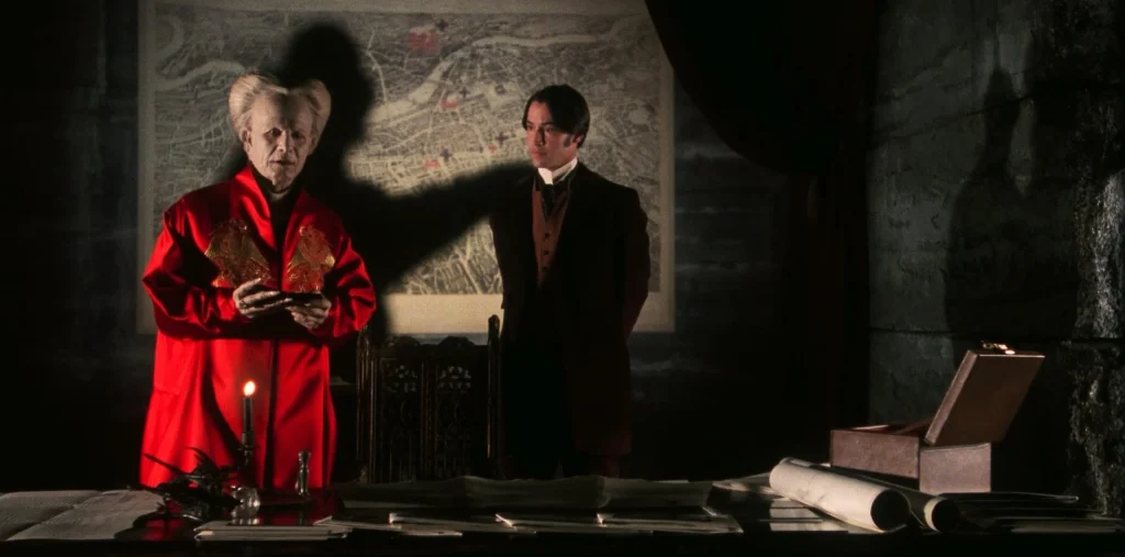 Dracula e Jonathan Harker con l'ombra del conte in Dracula di Bram Stoker (1992).