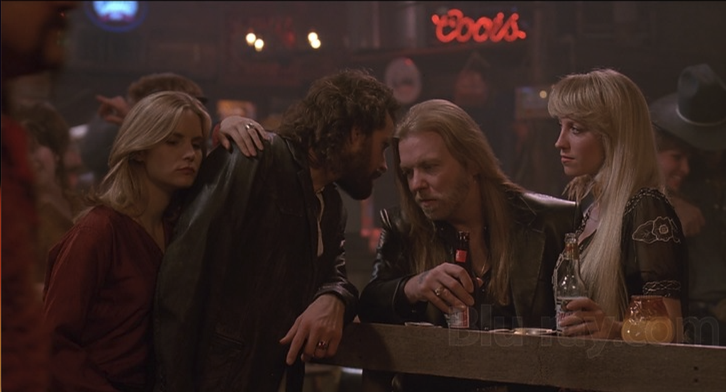 im e Kristen con Will Gaines in un locale, in una scena di Effetto allucinante (1991).
